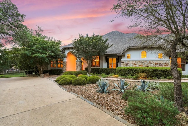 ranch-style home with stone siding and stucco siding
