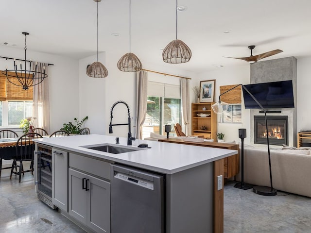 11000 5th St, Leander, TX 78645 - kitchen with dishwashing machine, open floor plan, concrete floors, beverage cooler, and a sink