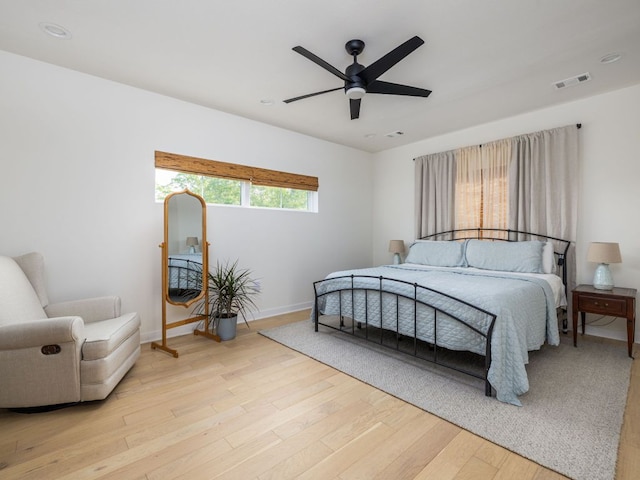 bedroom featuring visible vents, wood finished floors, baseboards, recessed lighting, and a ceiling fan