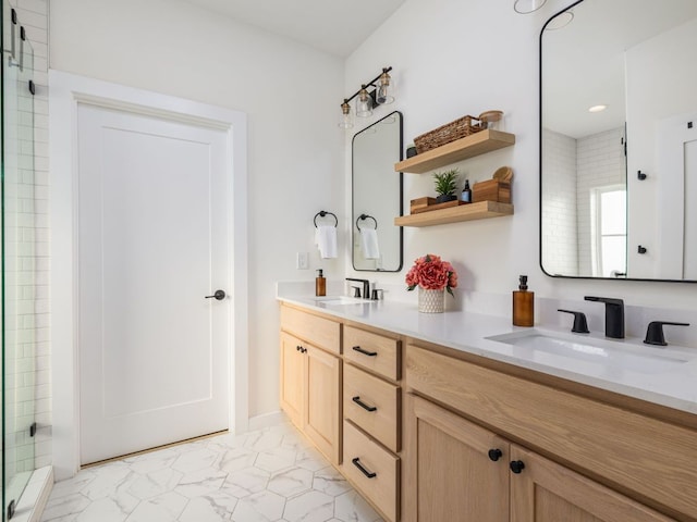 full bathroom featuring double vanity, tiled shower, a sink, and marble finish floor