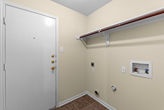 clothes washing area with laundry area, baseboards, dark tile patterned flooring, washer hookup, and hookup for an electric dryer