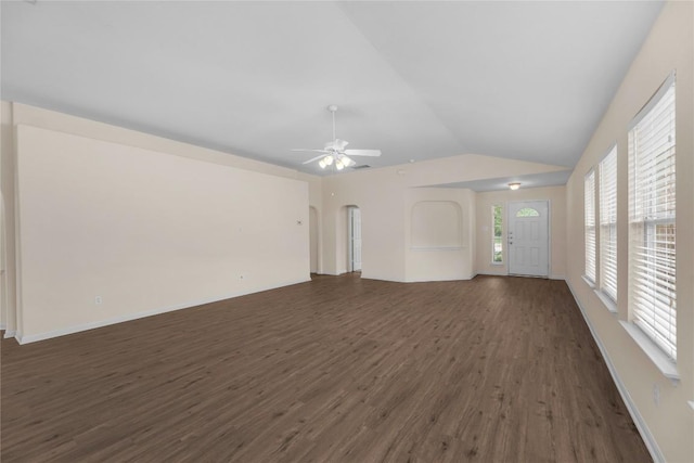 empty room featuring dark wood finished floors, ceiling fan, and lofted ceiling