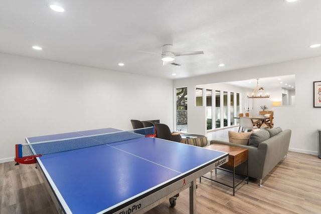 playroom featuring visible vents, baseboards, ceiling fan with notable chandelier, light wood-style floors, and recessed lighting