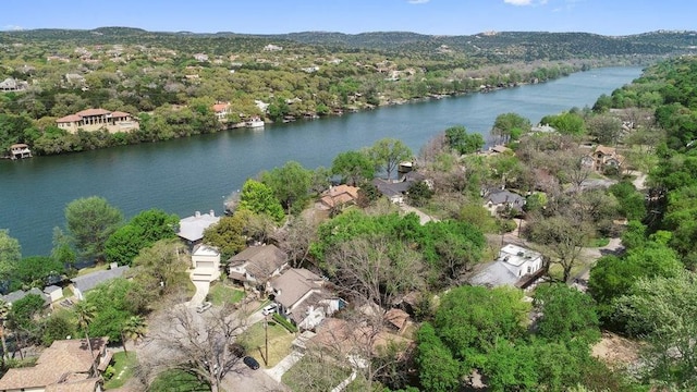 drone / aerial view with a water view and a residential view