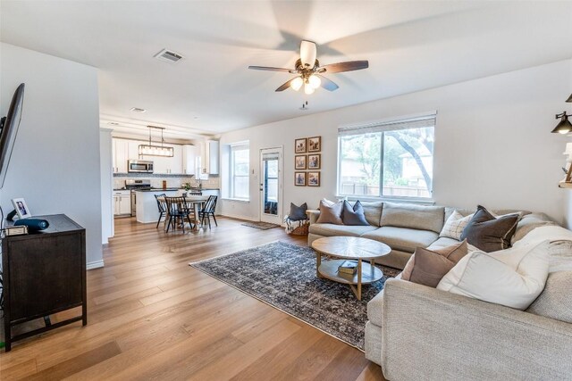 1161 Stone Forest Trl, Round Rock, TX 78681 - living room featuring light wood finished floors and a ceiling fan