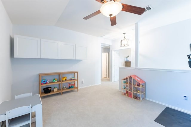 playroom featuring ceiling fan, light carpet, baseboards, vaulted ceiling, and visible vents