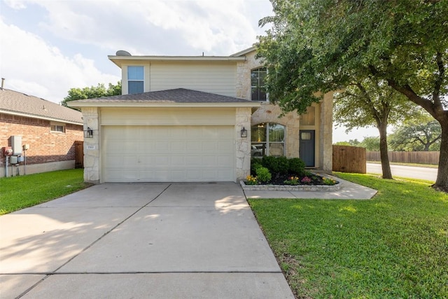 traditional-style home with a garage, driveway, stone siding, and a front lawn
