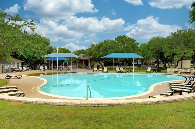 1161 Stone Forest Trl, Round Rock, TX 78681 - community pool with a patio area and a lawn