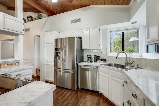 kitchen with appliances with stainless steel finishes, a sink, wooden ceiling, vaulted ceiling with beams, and visible vents