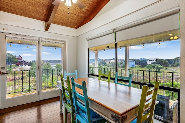 dining space with wood ceiling, a ceiling fan, vaulted ceiling, wood finished floors, and a wealth of natural light