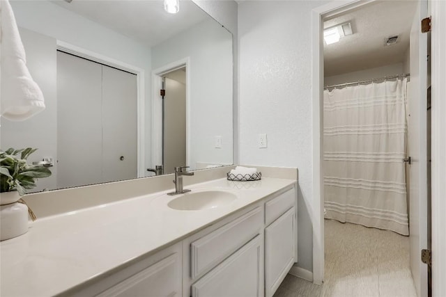 bathroom with visible vents and vanity
