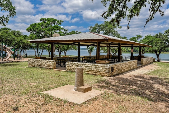 view of home's community featuring a yard, a water view, a gazebo, and playground community