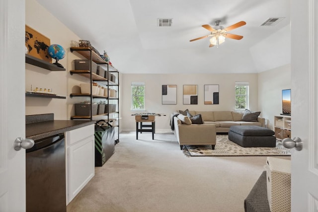 living room with baseboards, a ceiling fan, light colored carpet, and visible vents