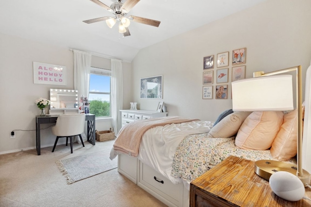 bedroom with a ceiling fan, baseboards, light carpet, and lofted ceiling