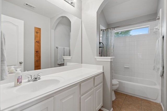 bathroom featuring visible vents, tile patterned flooring, vanity, toilet, and shower / bathtub combination with curtain