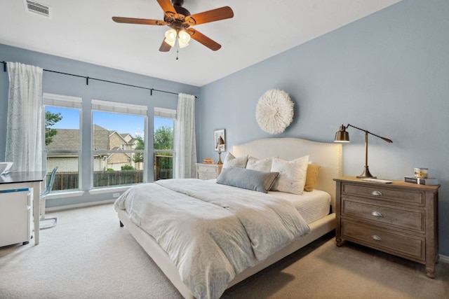 bedroom with ceiling fan, carpet flooring, and visible vents