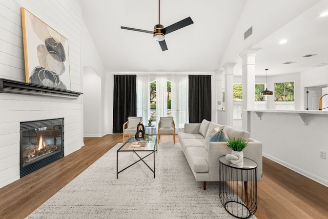 13300 Country Lake Dr, Austin, TX 78732 - living area with baseboards, lofted ceiling, wood finished floors, and visible vents