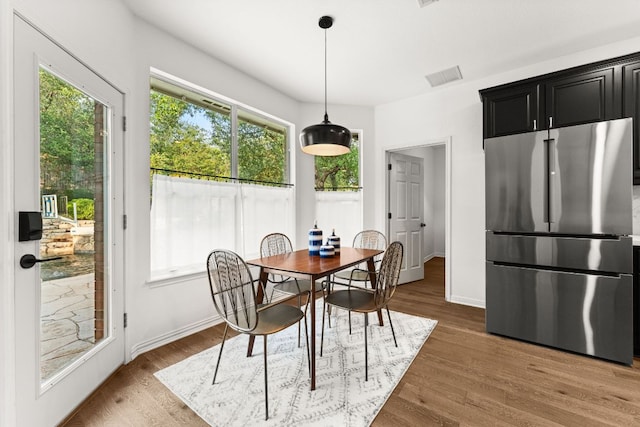 13300 Country Lake Dr, Austin, TX 78732 - dining room featuring healthy amount of natural light and wood finished floors
