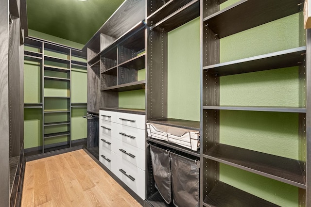 13300 Country Lake Dr, Austin, TX 78732 - walk in closet featuring wood finished floors