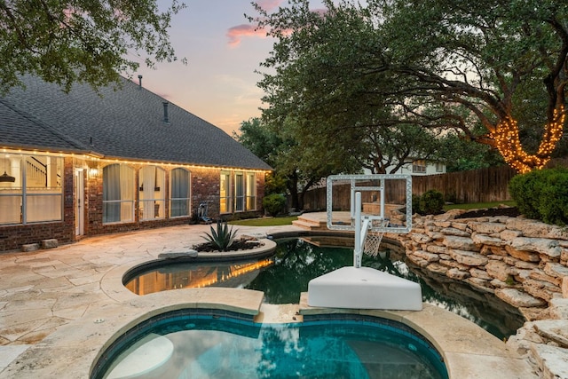 13300 Country Lake Dr, Austin, TX 78732 - view of swimming pool with a patio and a pool with connected hot tub