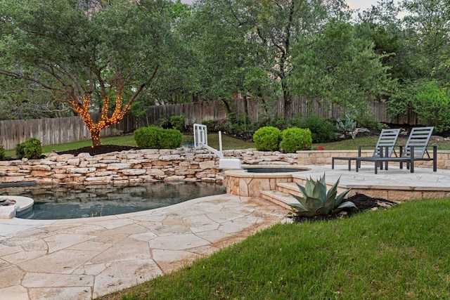 13300 Country Lake Dr, Austin, TX 78732 - view of patio featuring an in ground hot tub and a fenced backyard