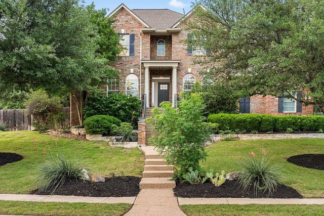 13300 Country Lake Dr, Austin, TX 78732 - view of front of house with fence, brick siding, and a front yard