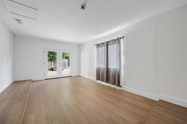 8221 Renton Dr, Austin, TX 78757 - unfurnished room with baseboards, visible vents, and light wood-style flooring