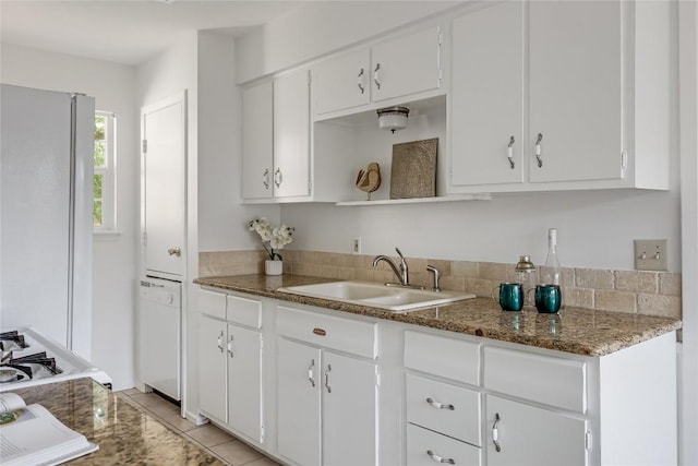 8221 Renton Dr, Austin, TX 78757 - kitchen with white cabinetry, open shelves, stone counters, and a sink