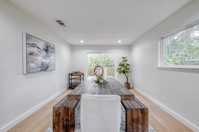 dining area with visible vents, recessed lighting, light wood-style floors, and baseboards