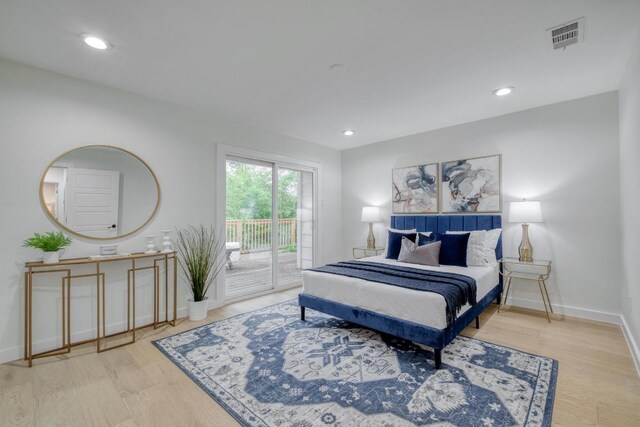 5307 Downs Dr, Austin, TX 78721 - bedroom featuring access to outside, wood finished floors, baseboards, and recessed lighting