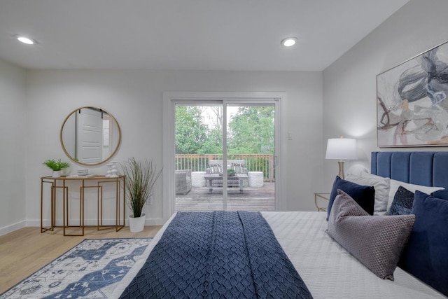 bedroom featuring baseboards, recessed lighting, wood finished floors, and access to exterior