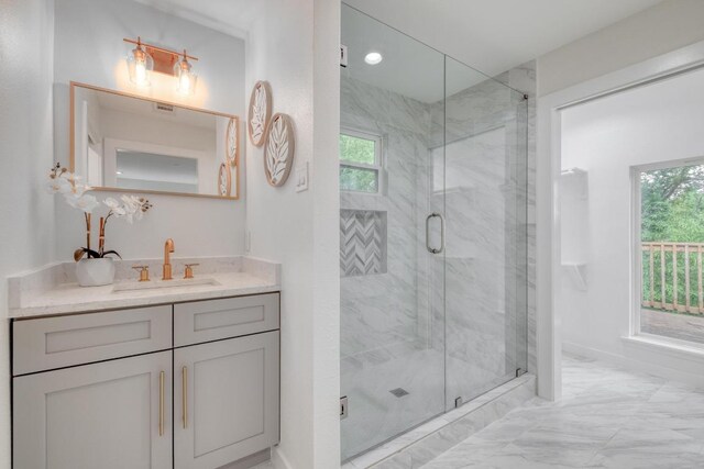 5307 Downs Dr, Austin, TX 78721 - full bath featuring vanity, marble finish floors, and a marble finish shower
