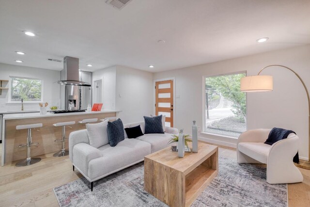 5307 Downs Dr, Austin, TX 78721 - living room with recessed lighting and light wood-type flooring
