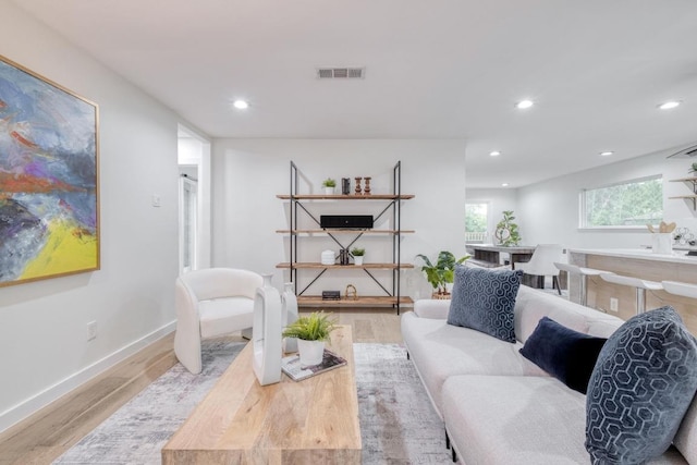 5307 Downs Dr, Austin, TX 78721 - living room with wood finished floors, recessed lighting, and baseboards