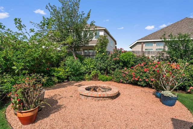 view of yard with an outdoor fire pit