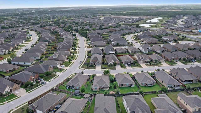 birds eye view of property with a water view and a residential view