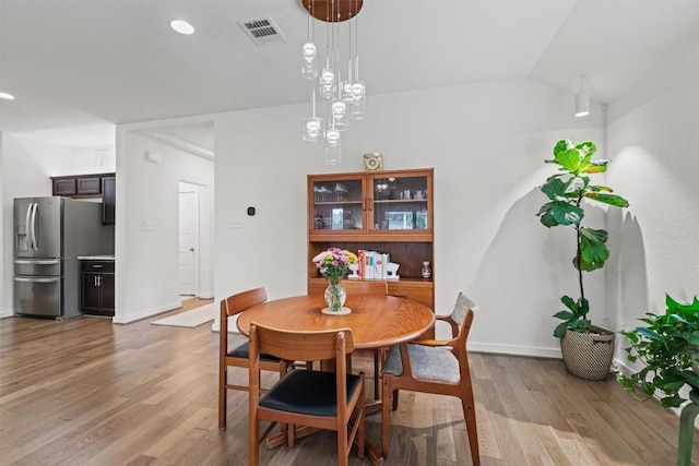 dining area with recessed lighting, baseboards, visible vents, and light wood-type flooring