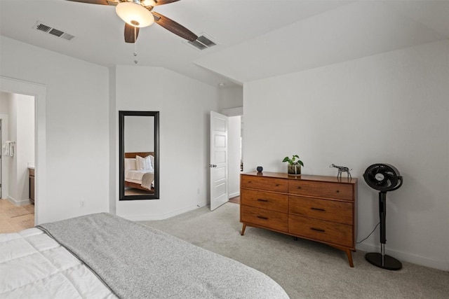 bedroom featuring baseboards, light colored carpet, and visible vents