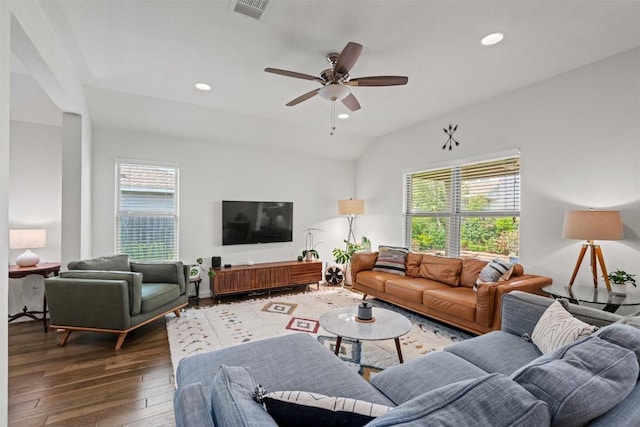 living room with visible vents, a ceiling fan, a wealth of natural light, and hardwood / wood-style flooring