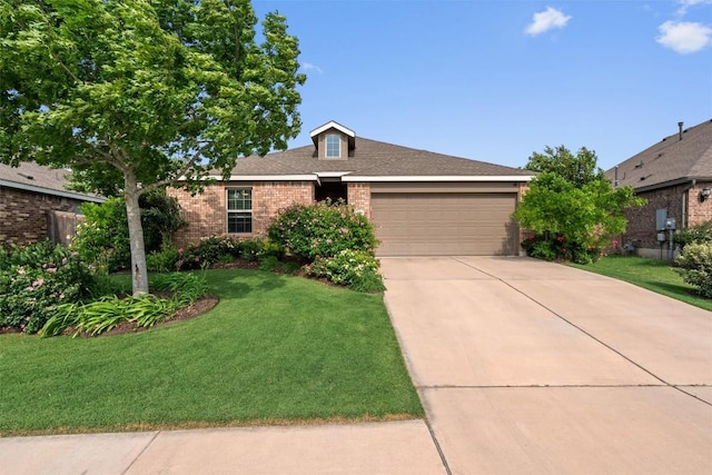 ranch-style home with an attached garage, a front lawn, and brick siding