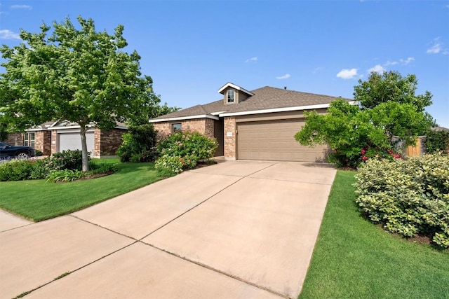 single story home featuring concrete driveway, brick siding, an attached garage, and a front yard