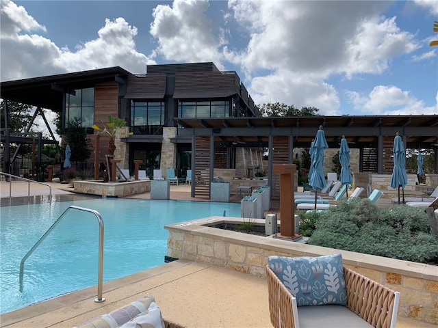 community pool with a patio area