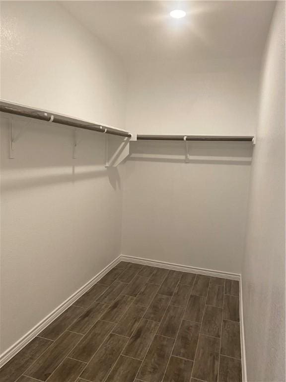 117 Bolivar Way Unit 101, San Marcos, TX 78666 - walk in closet featuring dark wood-style flooring