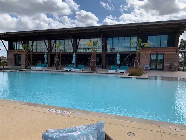 pool featuring a patio area and french doors
