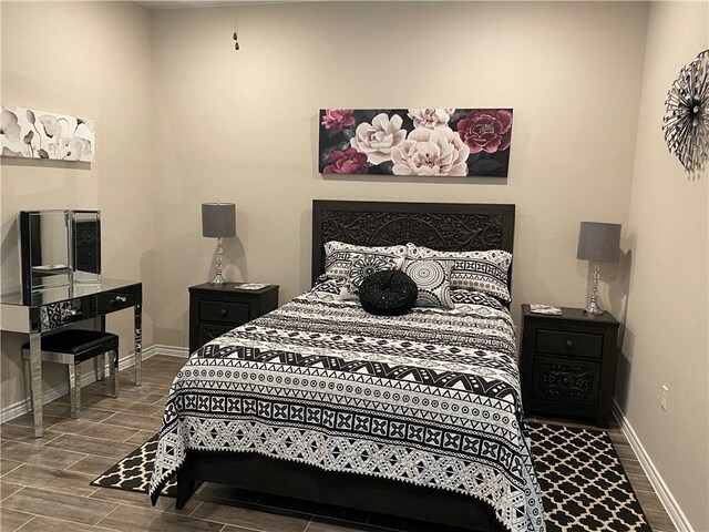 117 Bolivar Way Unit 101, San Marcos, TX 78666 - bedroom with wood tiled floors