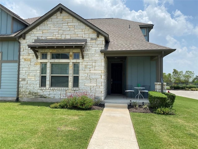 117 Bolivar Way Unit 101, San Marcos, TX 78666 - view of front of home featuring board and batten siding, stone siding, and a shingled roof