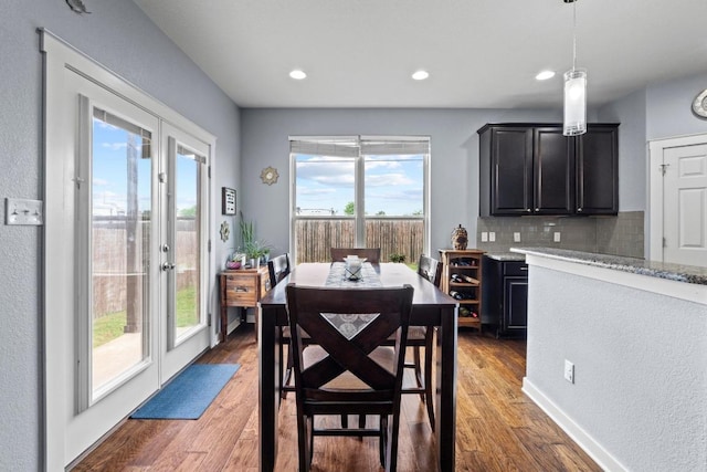 dining room with recessed lighting and light wood-type flooring