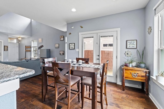 dining space featuring recessed lighting, baseboards, vaulted ceiling, and dark wood finished floors