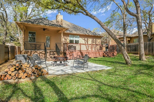 240 Fort Mabry Loop, Georgetown, TX 78628 - rear view of property featuring a fenced backyard, a ceiling fan, a chimney, and a lawn