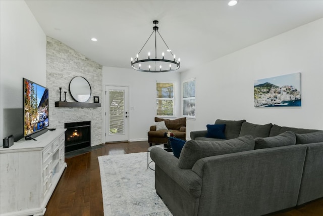 240 Fort Mabry Loop, Georgetown, TX 78628 - living area with an inviting chandelier, recessed lighting, dark wood finished floors, and a fireplace